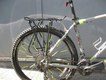 Багажник для велосипеда: опис велобагажников для гірських велосипедів, особливості задніх велосипедних багажників для велосипедів з колесами 26 і 29 дюймів, огляд консольних і універсальних моделей