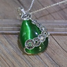 Камінь котяче око (42 фото): як виглядає натуральний мінерал? Значення і магічні властивості, опис рожевих і зелених, блакитних і білих каменів