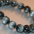 Камінь котяче око (42 фото): як виглядає натуральний мінерал? Значення і магічні властивості, опис рожевих і зелених, блакитних і білих каменів