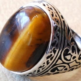 Камінь котяче око (42 фото): як виглядає натуральний мінерал? Значення і магічні властивості, опис рожевих і зелених, блакитних і білих каменів