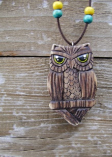 Кулон сова (33 фото): срібло і біле золото, що символізує срібний кулон у вигляді сови, його значення