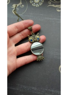 Кулон сова (33 фото): срібло і біле золото, що символізує срібний кулон у вигляді сови, його значення