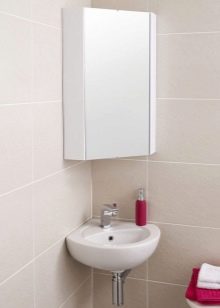 Навісні кутові шафи у ванну кімнату: особливості підвісних шафок, правила розміщення настінного меблів