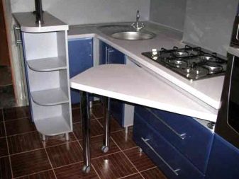 Овальний розсувний стіл на кухню (53 фото): розкладні кухонні обідні столи з масиву дерева, білі складні столи-книжки та інші моделі