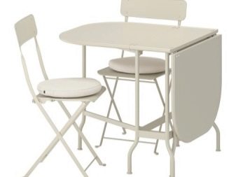 Овальний розсувний стіл на кухню (53 фото): розкладні кухонні обідні столи з масиву дерева, білі складні столи-книжки та інші моделі