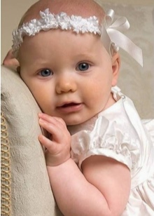 Пов’язки на голову для новонароджених (39 фото): моделі для малятка з квітами з фоамирана і з бантом