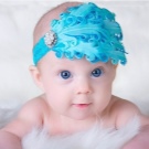 Пов’язки на голову для новонароджених (39 фото): моделі для малятка з квітами з фоамирана і з бантом