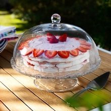 Тарілки з кришкою: металевий клош на підставці для подачі гарячих страв, прозорі скляні баранчики та інші види посуду